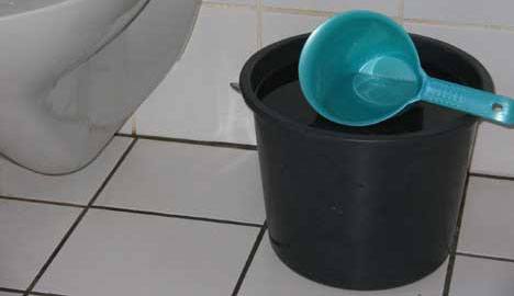 bucket with scoop, a typical bidet setup in Philippines or other 3rd world bathrooms.